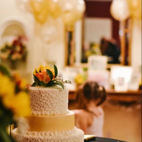 wedding cake next to flowers